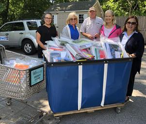 Good For Kids volunteers delivering school supplies